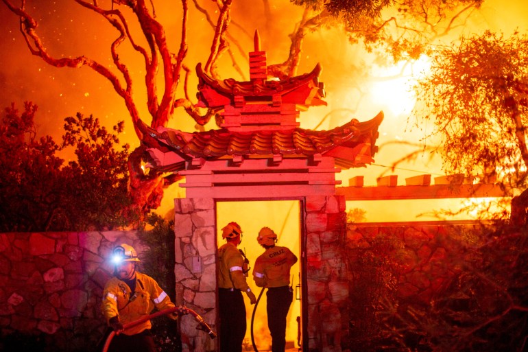 Firefighters battle the Palisades Fire as it burns during a windstorm on the west side of Los Angeles, California, U.S. January 8, 2025. REUTERS/Ringo Chiu TPX IMAGES OF THE DAY