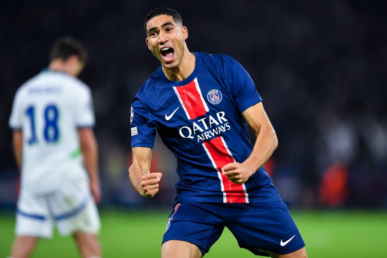 PARIS, FRANCE - OCTOBER 22: Achraf Hakimi of PSG celebrates after scoring his team's first goal during the UEFA Champions League 2024/25 League Phase MD3 match between Paris Saint-Germain and PSV Eindhoven at Parc des Princes on October 22, 2024 in Paris, France. (Photo by Franco Arland/Getty Images)