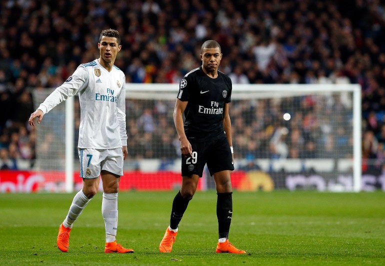 SANTIAGO BERNABéU, MADRID, SPAIN - 2018/02/14: Cristiano Ronaldo (Real Madrid) and Kylian Mbappe (Paris Saint Germain) during the UEFA Champions league round of 16 match first leg football match between Real Madrid and Paris Saint Germain at Santiago Bernabeu stadium in Madrid. (Photo by Manu Reino/SOPA Images/LightRocket via Getty Images)