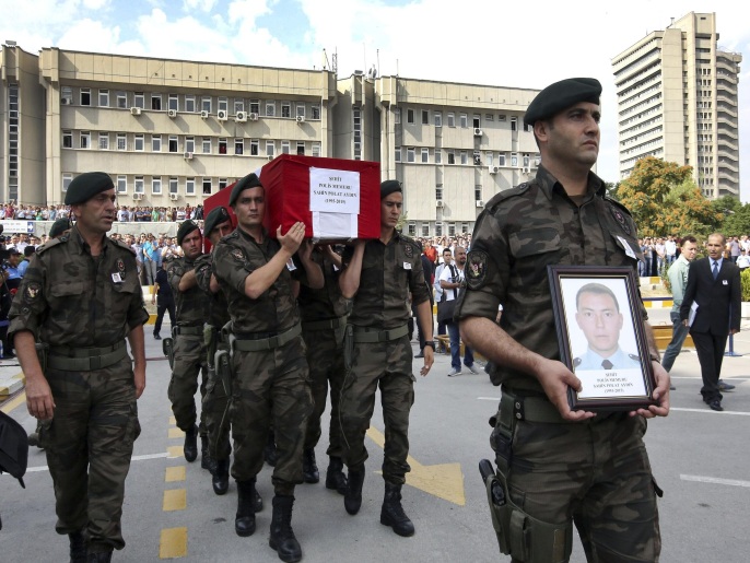 Turkish police officers carry the coffin of Turkish police special operations officer Sahin Polat Aydin, one of the four officers killed Monday in a landmine attack attributed to militants of the Kurdistan Workers' Party, or PKK, in Silopi, southeastern Turkey, during a ceremony in Ankara, Tuesday, Aug. 11, 2015. Turkey has seen a sharp spike in clashes between security forces and Kurdish rebels in recent weeks. At least 48 people have died during the renewed violence that has wrecked an already fragile peace process with the Kurds. (AP Photo)