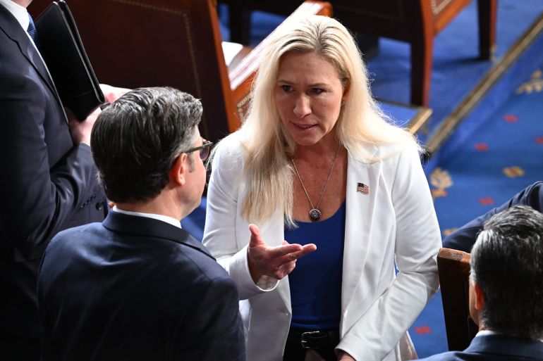 US Representative Marjorie Taylor Greene speaks with House Speaker Mike Johnson (L) arrive for the address by Japanese Prime Minister Fumio Kishida to a joint meeting of Congress at the US Capitol in Washington, DC, April 11, 2024. (Photo by SAUL LOEB / AFP)