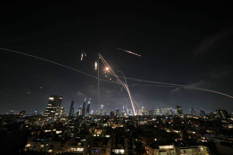 Israeli Iron Dome air defense system fires to intercept missiles over Tel Aviv, Israel, Friday, June 13, 2025. (AP Photo/Leo Correa)