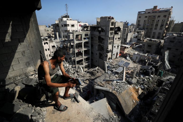 A Palestinian looks on at the site of Thursday's Israeli strike that damaged and destroyed residential buildings, at Shati (Beach) refugee camp, in Gaza City, July 4, 2025. REUTERS/Mahmoud Issa TPX IMAGES OF THE DAY