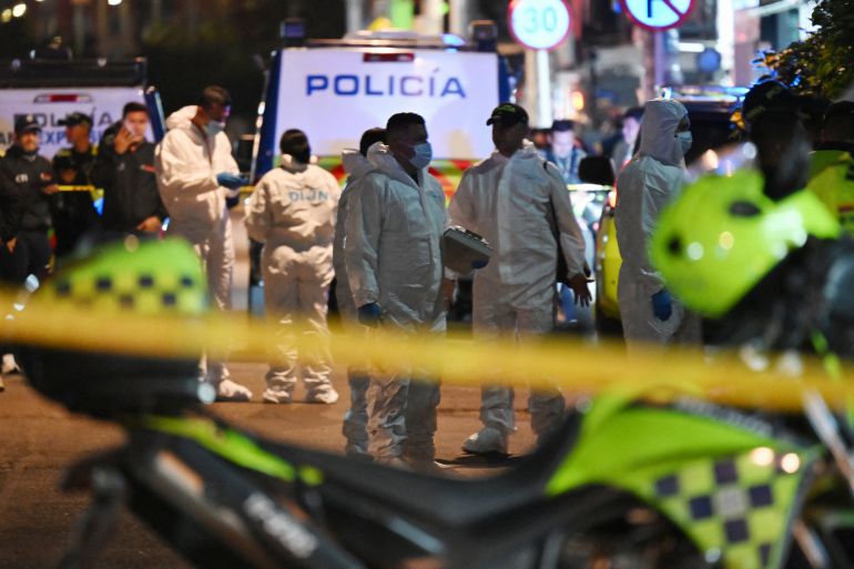 TOPSHOT - Forensic experts work at the crime scene where Senator Miguel Uribe was shot and wounded in the Modelia neighborhood in Bogota on June 7, 2025.