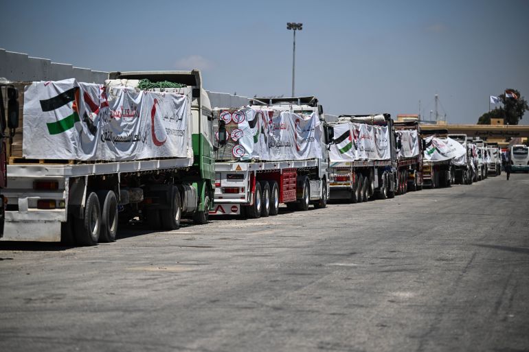 epa12286392 Trucks loaded with humanitarian aid queue at the Rafah Border gate, between Egypt and the Gaza Strip, Rafah, North Sinai Governorate, Egypt, 06 August 2025. EPA/MOHAMED HOSSAM
